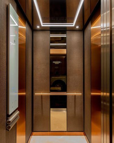 LEVELe-105 Elevator Interior with customized panel layout; Capture panels in Bonded Bronze with D… _ Elevator lobby design, Cabin interior design, Elevator interior